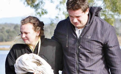 Distraught friends of missing fisherman Justin Anderson at Wivenhoe Dam. Distraught friends of missing fisherman Justin Anderson at Wivenhoe Dam.